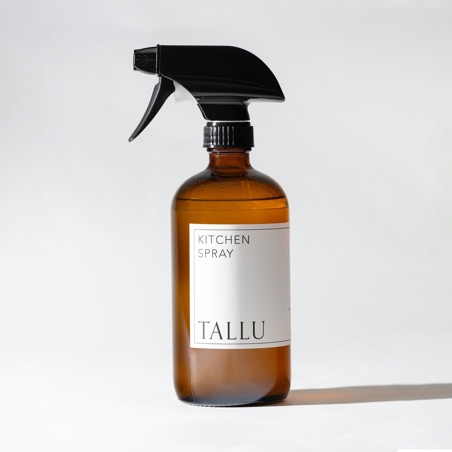 Front view of Tallu Kitchen Spray, a natural, non-toxic cleaner in a sleek bottle.